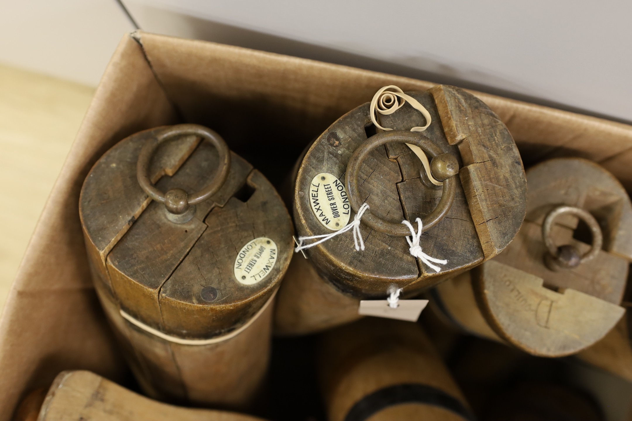 An assortment of beech boot-trees and folding boot hooks